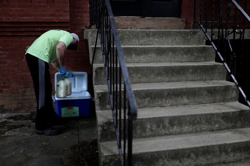 A man delivers milk at Capitol Hill as coronavirus disease (COVID-19) continues to spread in Washington