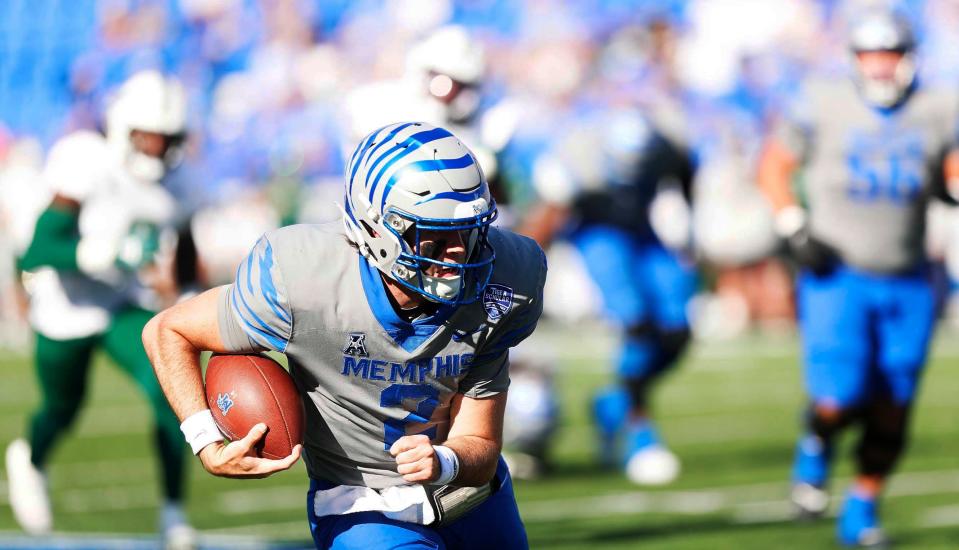 Memphis' Seth Henigan (2) rushes toward the end zone against South Florida.