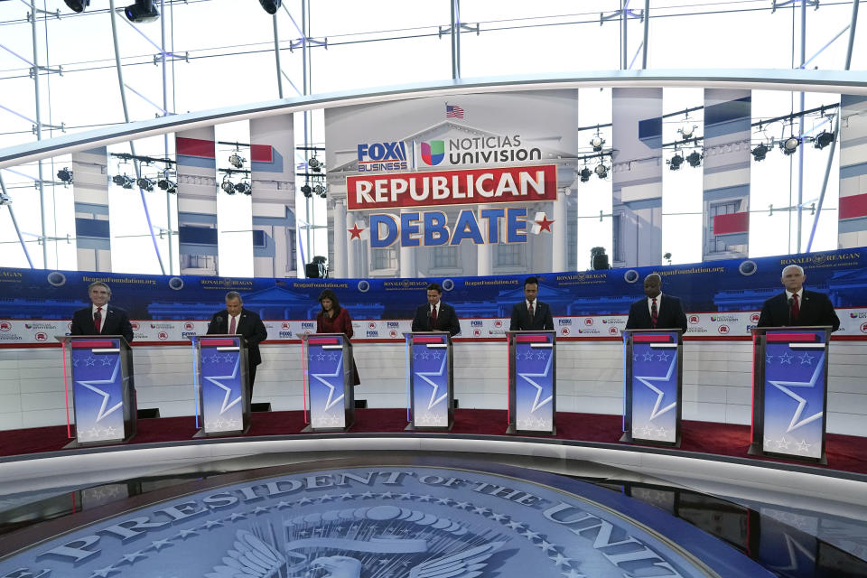 Republican presidential candidates, from left, North Dakota Gov. Doug Burgum, former New Jersey Gov. Chris Christie, former U.N. Ambassador Nikki Haley, Florida Gov. Ron DeSantis, entrepreneur Vivek Ramaswamy, Sen. Tim Scott, R-S.C., and former Vice President Mike Pence, stand at their podiums during a Republican presidential primary debate hosted by FOX Business Network and Univision, Wednesday, Sept. 27, 2023, at the Ronald Reagan Presidential Library in Simi Valley, Calif. (AP Photo/Mark J. Terrill)