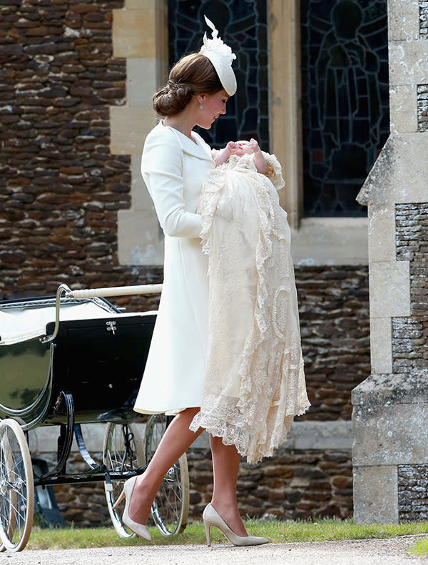 <p><br>Kate was wearing a Duchess Kate, wearing a white Alexander McQueen coat dress and matching hat by Jane Taylor, while her daughter was dressed in the same christening gown worn by her brother, Prince George, on his christening. <br><br>The gown is an exact replica of the one worn by Queen Victoria's first child some 174 years ago and was worn by all the senior royals right down to Princes William and Harry. <br><br><b><a rel="nofollow" href="https://au.lifestyle.yahoo.com/new-idea/a/28666617/the-christening-of-princess-charlotte-of-cambridge/ " data-ylk="slk:Click here for all the info on Princess Charlotte's christening!;elm:context_link;itc:0;sec:content-canvas" class="link ">Click here for all the info on Princess Charlotte's christening!</a><b><br><br><b><a rel="nofollow" href="https://au.lifestyle.yahoo.com/new-idea/news/royal/#page1" data-ylk="slk:Click here for more of the latest royal news!;elm:context_link;itc:0;sec:content-canvas" class="link ">Click here for more of the latest royal news!</a></b></b></b></p>