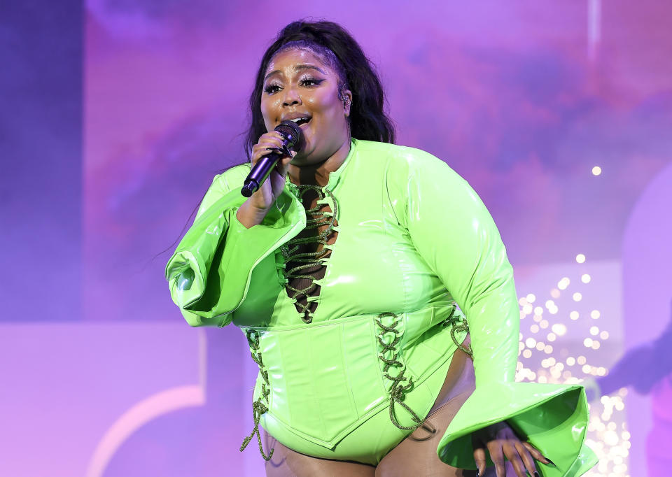 Lizzo onstage in a leotard