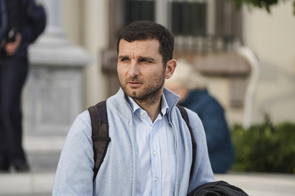 Nasos Karakitsos, one of 24 aid workers and volunteers accused one of 24 aid workers and volunteers accused of participating in migrant rescue operations, waits outside the court in Mytilene, on the northeastern Aegean island of Lesbos, Greece, Tuesday, Jan. 10, 2023. A Greek court was set to hear a smuggling-related criminal case Tuesday against a group of 24 aid workers and volunteers. The defendants deny all charges and say all they did was help rescue endangered people. International human rights groups have widely criticized the prosecution. (AP Photo/Panagiotis Balaskas)