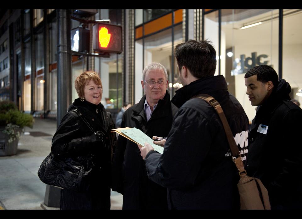 Karen Watson, left and Barry Watson are interviewed by Joe Hallmark during a homeless count in New York. The New York City Department of Homeless Services assisted by volunteers put on a homeless count in the borough of Manhattan's Murray Hill neighborhood Jan. 30, 2012. (Damon Dahlen, AOL)