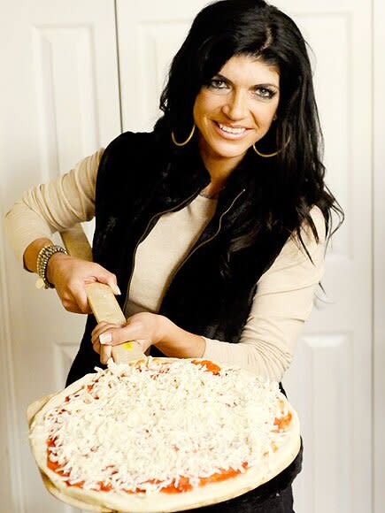 After giving birth to her fourth daughter Audriana, Teresa got herself a new body — upping from an A cup to a C — and a new career as a cookbook author. Her first book, <em>Skinny Italian</em>, published in May 2010, became a <em>New York Times</em> Best-Seller. She also released a cocktail and hair care line, but her sudden success caused friction among her castmates. As new <em>Housewives</em> — including her sister-in-law Melissa Gorga and cousin Kathy Wakile — joined the show, Giudice fought with them too, prompting former friend Jacqueline Laurita to tweet, "Teresa is scum!"