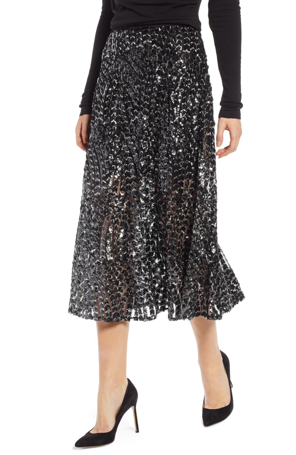 <p><strong>SOMETHING NAVY</strong></p><p>nordstrom.com</p><p><strong>$125.00</strong></p><p><a rel="nofollow noopener" href="https://shop.nordstrom.com/s/something-navy-sequin-midi-skirt-nordstrom-exclusive/5062922" target="_blank" data-ylk="slk:Shop Now;elm:context_link;itc:0;sec:content-canvas" class="link ">Shop Now</a></p>Prepare to shine in this stunning midi that's blanketed in party-ready sparkle. This chic style is part of fashion influencer Arielle Charnas's much-anticipated collection that embodies approachable fashion with a luxe sensibility."/