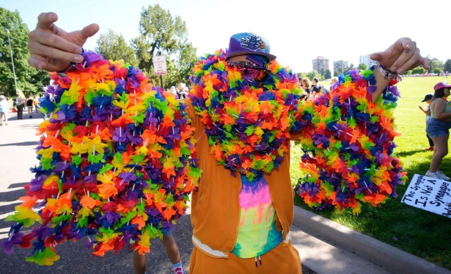 Toby Bryant of Denver takes part in the Pride parade through the streets of downtown Denver, Sunday, June 25, 2023. (AP Photo/David Zalubowski)