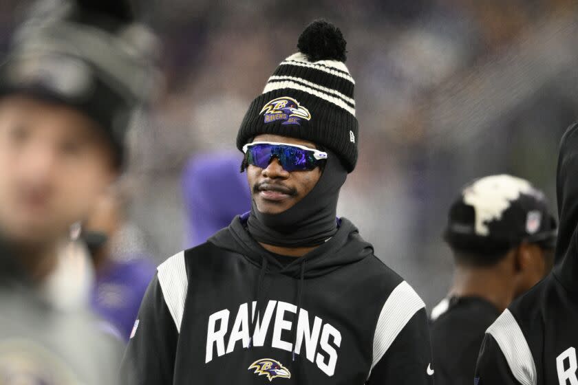 Baltimore Ravens quarterback Lamar Jackson (8) looks on during the second half of an NFL football game