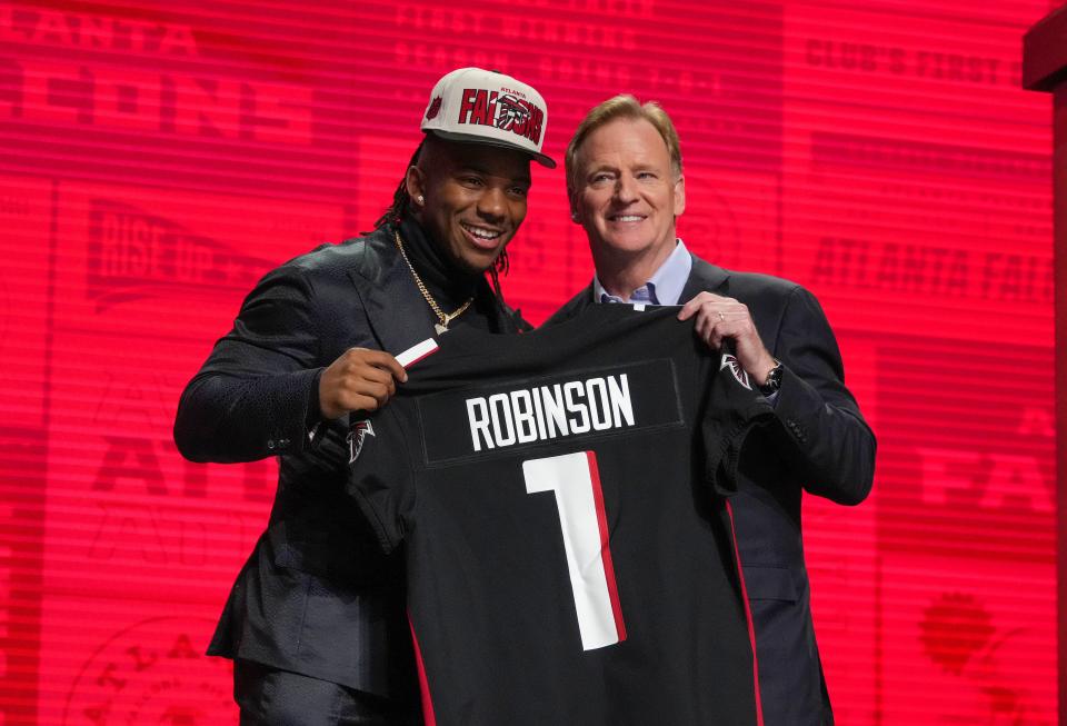 Texas running back Bijan Robinson with NFL commissioner Roger Goodell after being selected by the Atlanta Falcons eighth overall in the first round of the 2023 NFL Draft at Union Station.