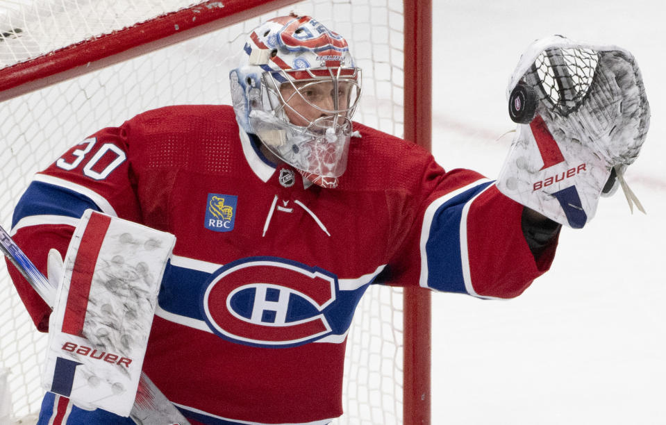 Montreal Canadiens goaltender Cayden Primeau makes a glove save against the Anaheim Ducks during the second period of an NHL hockey game Tuesday, Feb. 13, 2024, in Montreal. (Christinne Muschi/The Canadian Press via AP)