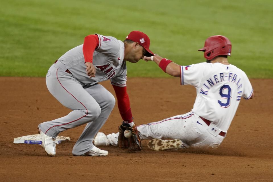 Los Angeles Angels shortstop Jose Iglesias, left, catches a throw to the bag as Texas Rangers' Isiah Kiner-Falefa steals second base in the fifth inning of a baseball game in Arlington, Texas, Monday, Aug. 2, 2021. (AP Photo/Tony Gutierrez)