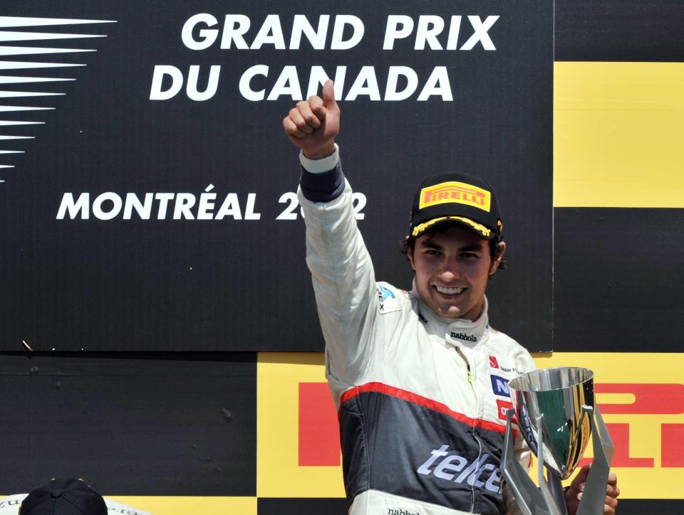 Third place finisher Sauber Ferrari driver Sergio Perez of Mexico holds up the trophy on the podium after the Canadian Formula One Grand Prix on June 10, 2012 at the Circuit Gilles Villeneuve in Montreal. AFP PHOTO/Stan HONDASTAN HONDA/AFP/GettyImages