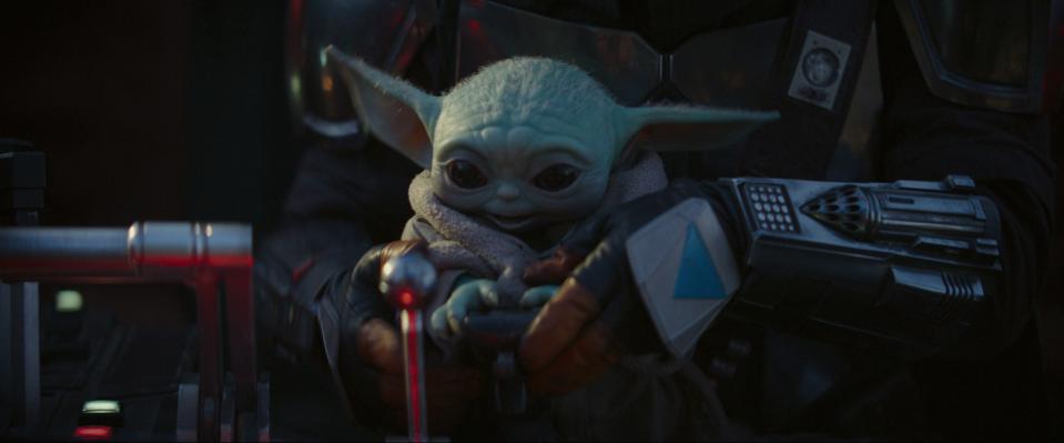 Baby Yoda is the adorable little guy who flies through space with his armored guardian, the title character of "The Mandalorian."