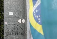 A message that reads "Addio campione" (Goodbye champion) is pictured on a fence at the site where Formula One Brazilian driver Ayrton Senna died at the race track in Imola April 22, 2014. REUTERS/Alessandro Garofalo