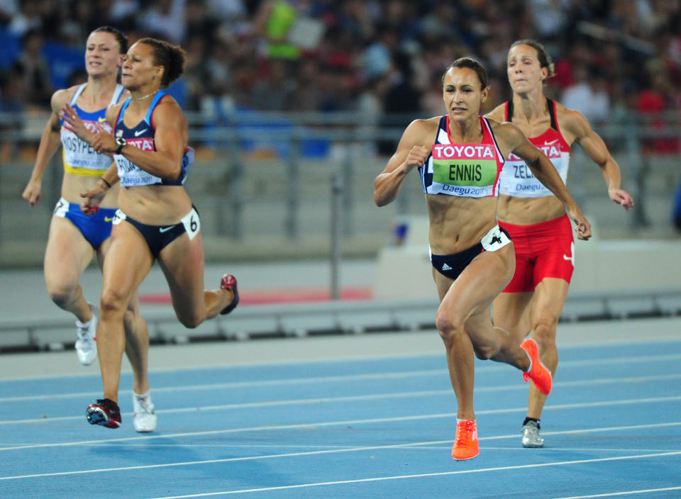 Britain's Jessica Ennis (2R) wins the 200 metres of the women's heptathlon event at the International Association of Athletics Federations (IAAF) World Championships in Daegu on August 29, 2011.  AFP PHOTO / MARK RALSTON (Photo credit should read MARK RALSTON/AFP/Getty Images)