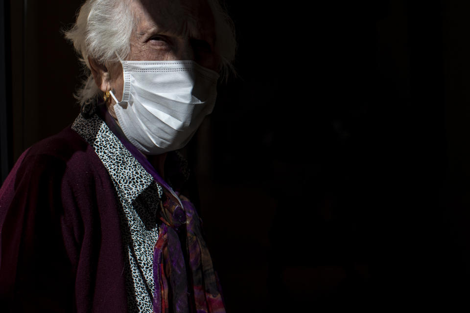 A resident wearing a face mask to protect against the stands at DomusVi nursing home in Leganes, Spain, Wednesday, March 10, 2021. (AP Photo/Manu Fernandez)