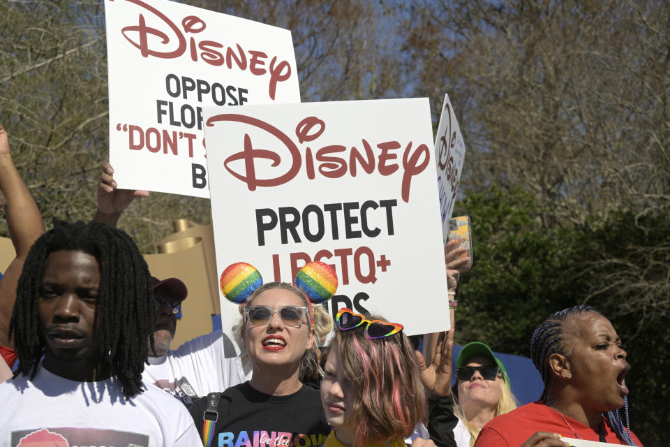 A protest outside Disney World in March - Credit: Phelan M. Ebenhack/AP Images for AIDS Healthcare Foundation