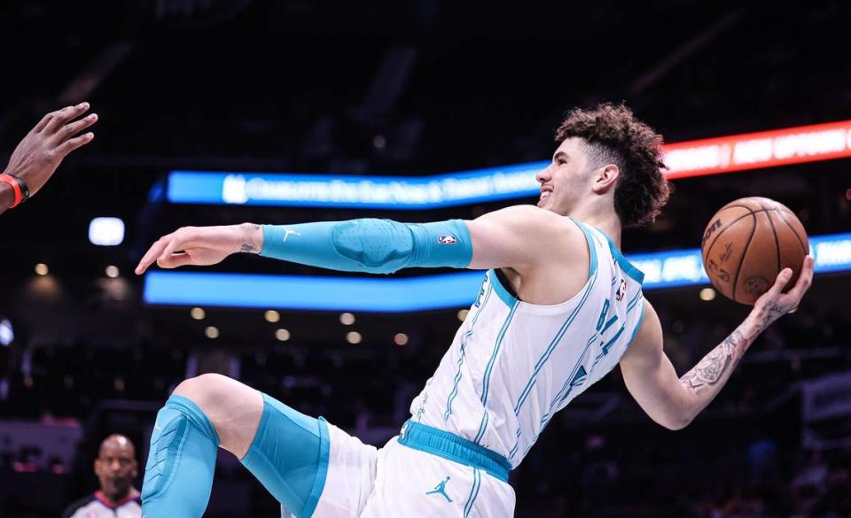 Charlotte Hornets guard LaMelo Ball passes the ball to a teammate against the Atlanta Hawks at the Spectrum Center in February 2023.