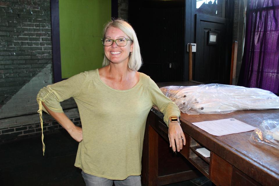 Arts Revive leader Becky Youngblood takes time out for a breather at her office overlooking the Alabama River in Selma.