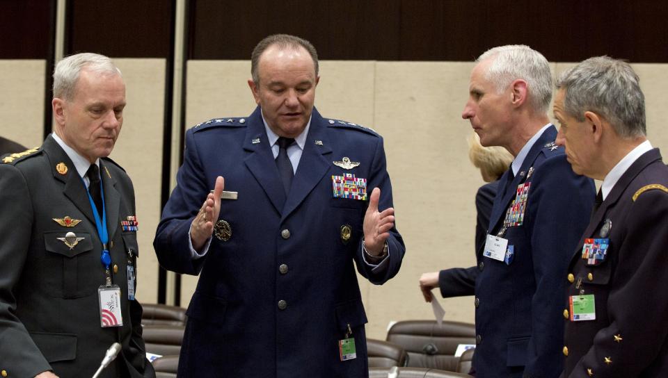 U.S. Air Force Gen. Philip Breedlove, the Supreme Allied Commander in Europe, second left, speaks to colleagues during a meeting of the North Atlantic Council with Non-NATO ISAF Contributing Nations at NATO headquarters in Brussels on Wednesday, April 2, 2014. (AP Photo/Virginia Mayo)