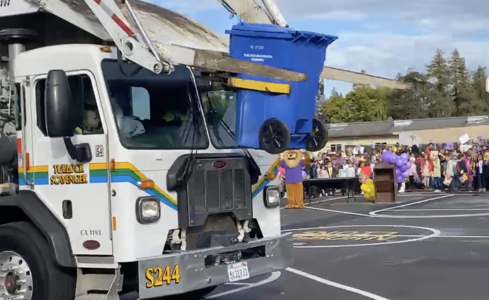 Carter Gomes, 7, sits in the passenger seat of a Turlock Scavenger collection truck on Nov. 7. The Make-A-Wish Foundation granted Carter, who has battled leukemia since he was 3, his wish of becoming a garbage man for a day in Turlock, California.