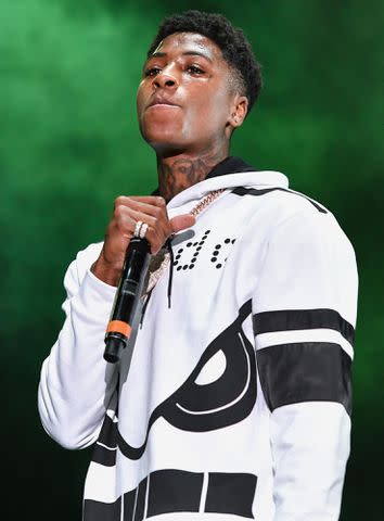 <p>Erika Goldring/Getty </p> NBA YoungBoy performs during Lil WeezyAna at Champions Square on August 25, 2018 in New Orleans, Louisiana.