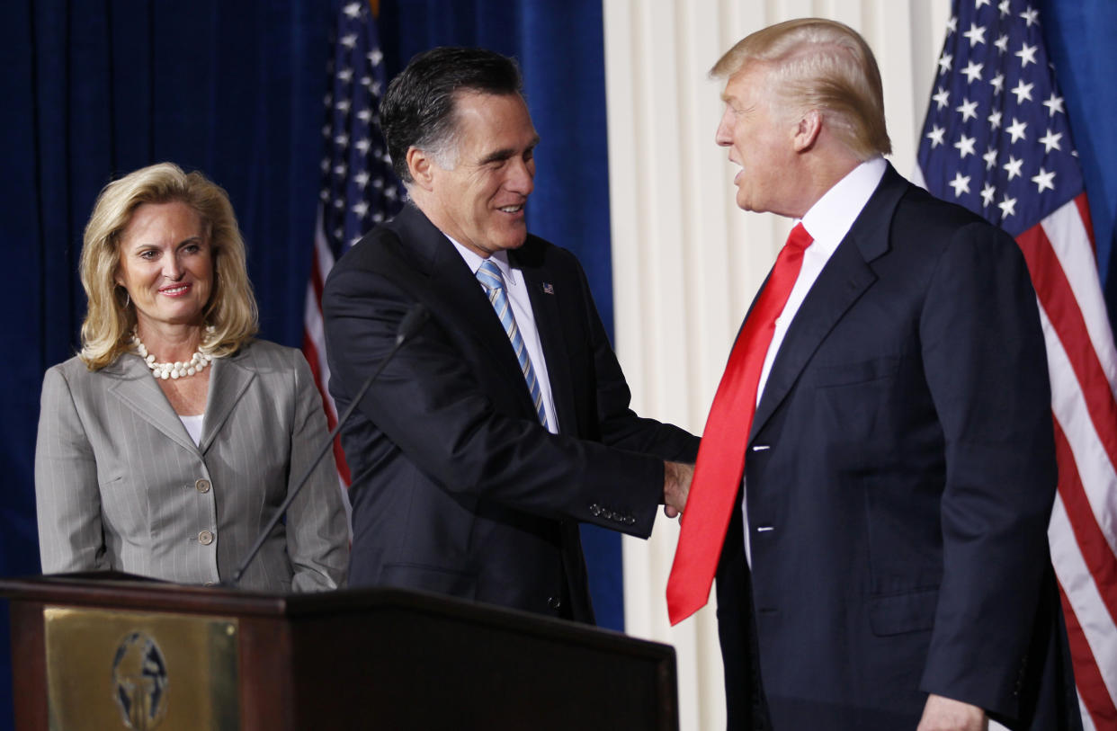 Republican presidential candidate Mitt Romney is endorsed by Donald Trump at the Trump Hotel in Las Vegas on Feb. 2, 2012. (Photo: Rick Wilking/Reuters)