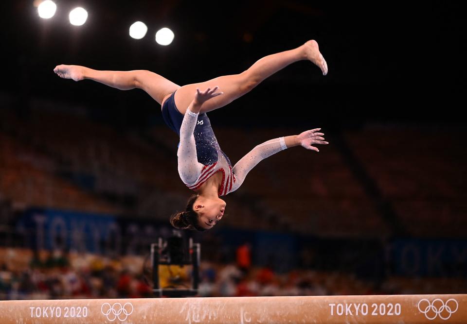 TOPSHOT - USA's Sunisa Lee competes in the balance beam event of the artistic gymnastics women's all-around final during the Tokyo 2020 Olympic Games at the Ariake Gymnastics Centre in Tokyo on July 29, 2021. / AFP / Loic VENANCE