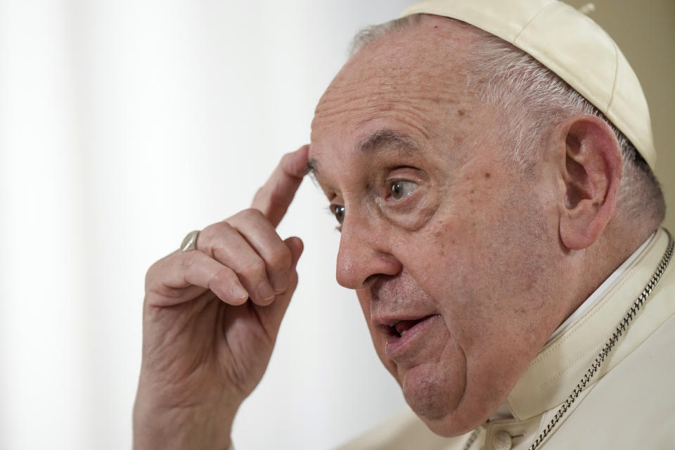 Pope Francis speaks during an interview with The Associated Press at the Vatican, Tuesday, Jan. 24, 2023. Francis acknowledged that Catholic bishops in some parts of the world support laws that criminalize homosexuality or discriminate against the LGBTQ community, and he himself referred to homosexuality in terms of "sin." But he attributed attitudes to culture backgrounds, and said bishops in particular need to undergo a process of change to recognize the dignity of everyone. (AP Photo/Andrew Medichini)