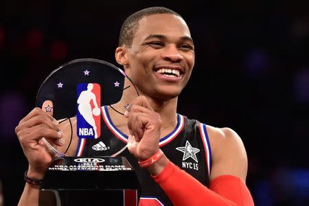 February 15, 2015; New York, NY, USA; Western Conference guard Russell Westbrook of the Oklahoma City Thunder (0) wins the MVP trophy after the 2015 NBA All-Star Game at Madison Square Garden. The West defeated the East 163-158. Mandatory Credit: Bob Donnan-USA TODAY Sports