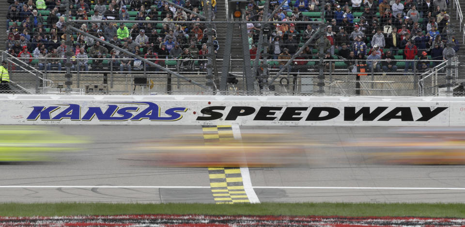 Drivers cross the start/finish line early in theNASCAR Cup Series auto race at Kansas Speedway in Kansas City, Kan., Saturday, May 11, 2019. (AP Photo/Orlin Wagner)