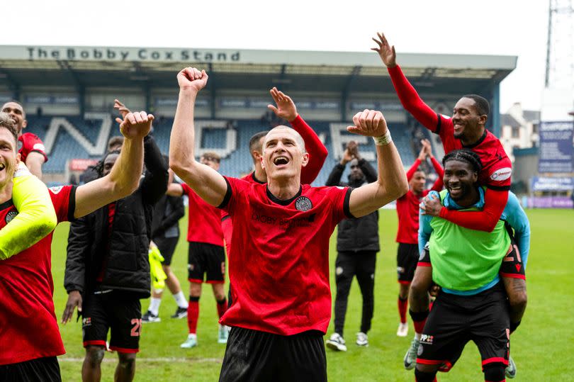 Alex Gogic leads the celebrations after St Mirren's 3-1 win at Dundee set them on the road to Europe