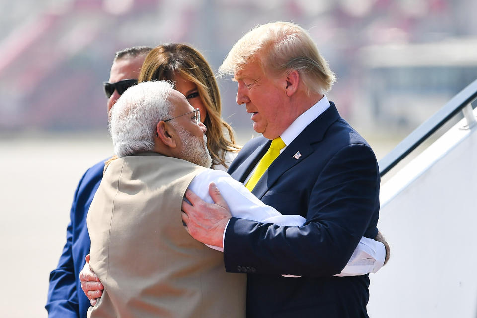 India's Prime Minister Narendra Modi (L) embraces US President Donald Trump upon his arrival at Sardar Vallabhbhai Patel International Airport in Ahmedabad on February 24, 2020. (Photo by MANDEL NGAN / AFP) (Photo by MANDEL NGAN/AFP via Getty Images)