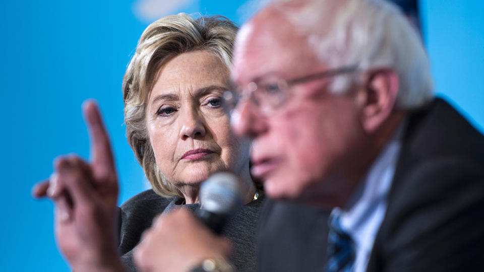 Democratic presidential nominee Hillary Clinton listens as Senator Bernie Sanders (I-VT) speaks during an event at University of New Hampshire September 28, 2016 in Durham, New Hampshire. (Photo: Brendan Smialowski/AFP via Getty Images)