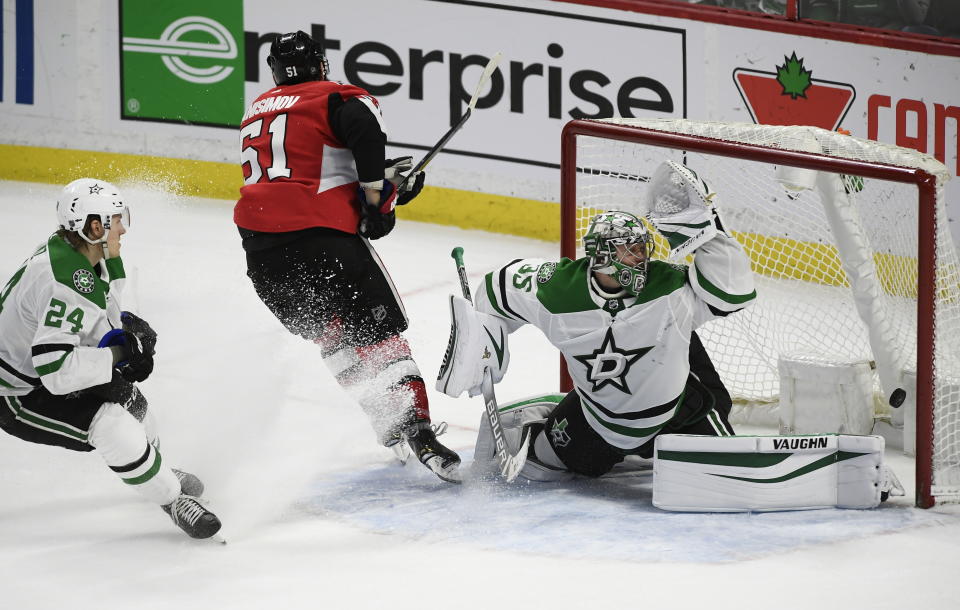 Ottawa Senators center Artem Anisimov (51) scores on Dallas Stars goaltender Anton Khudobin (35) in overtime of an NHL hockey game Sunday, Feb. 16, 2020, in Ottawa, Ontario. (Justin Tang/The Canadian Press via AP)