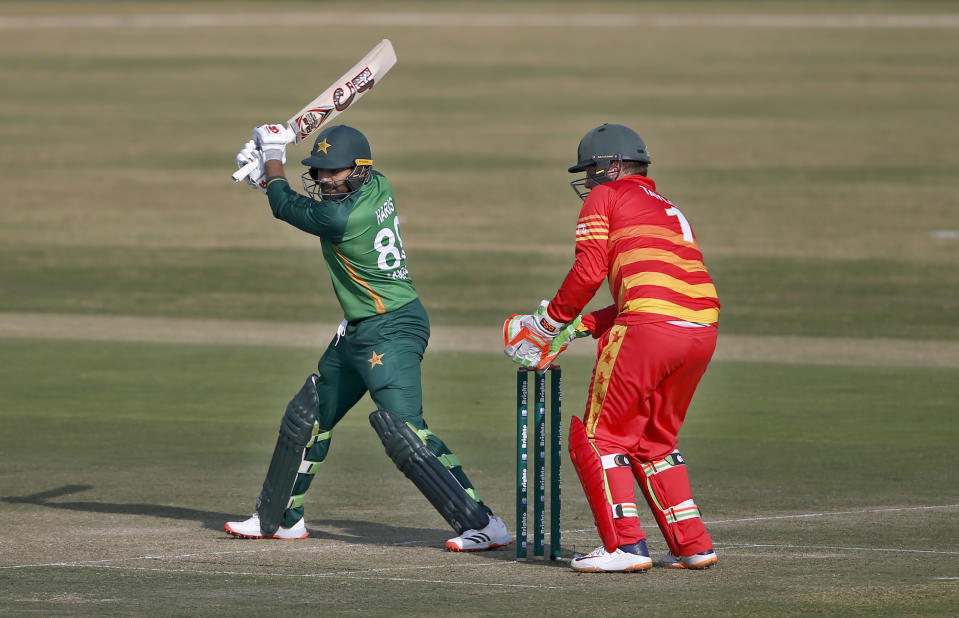 Zimbabwe's wicketkeeper Brendan Taylor, right, takes a catch of Pakistani batsman Haris Sohail, left, during their 1st one-day international cricket match at the Pindi Cricket Stadium, in Rawalpindi, Pakistan, Friday, Oct. 30, 2020. (AP Photo/Anjum Naveed)