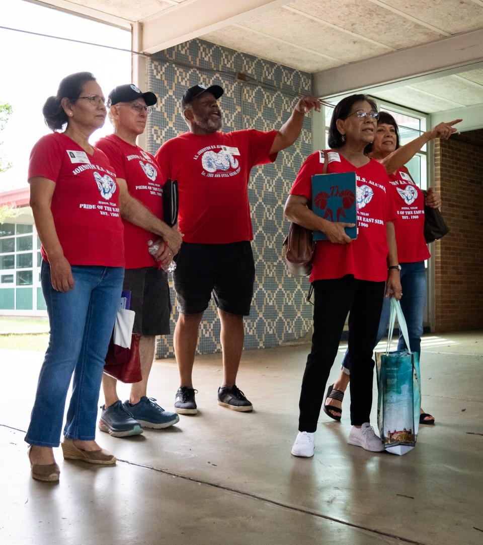 From left, Barbara Escamilla, Rudy Landeros, Rodrick Brown, Pauline Garza and Janie Ruiz reminisce about their high school years in the school's courtyard.