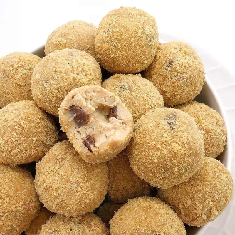 <p>Chef Not Required</p><p>No-bake cookie dough truffles with a cream cheese twist, rolled in cookie crumbs for that cheesecake taste straight from your freezer!</p><p><strong>Get the recipe: </strong><a href="https://www.chefnotrequired.com/cookie-dough-cheesecake-bites/" rel="nofollow noopener" target="_blank" data-ylk="slk:Frozen Cheesecake Bites;elm:context_link;itc:0;sec:content-canvas" class="link rapid-noclick-resp"><strong>Frozen Cheesecake Bites </strong></a></p>