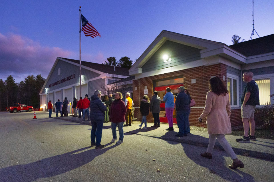 FILE - Voters wait for the doors to open at 6:00 AM to cast their ballots at the fire station on Election Day, Nov. 8, 2022, in New Gloucester, Maine. Maine's vaunted independent voters are becoming scarcer as Super Tuesday approaches.(AP Photo/Robert F. Bukaty, File)