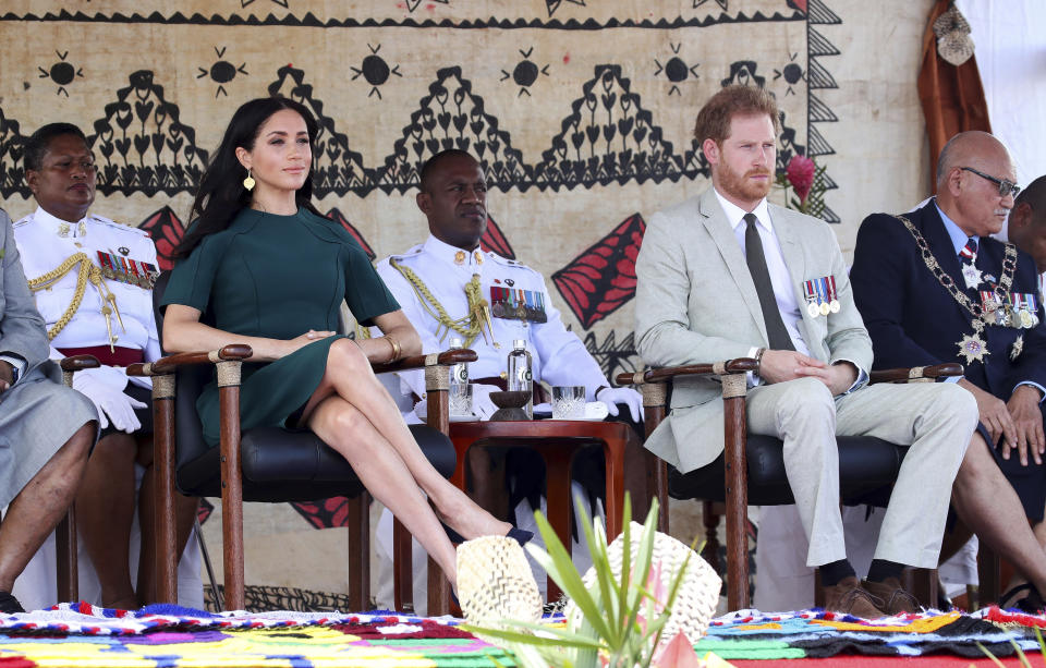 Britain's Prince Harry and Meghan, Duchess of Sussex attend an offical ceremony in Nadi, Fiji, Thursday, Oct. 25, 2018. Britain's Prince Harry and his wife Meghan are on day 10 of their 16-day tour of Australia and the South Pacific. (Chris Jackson/Pool Photo via AP)