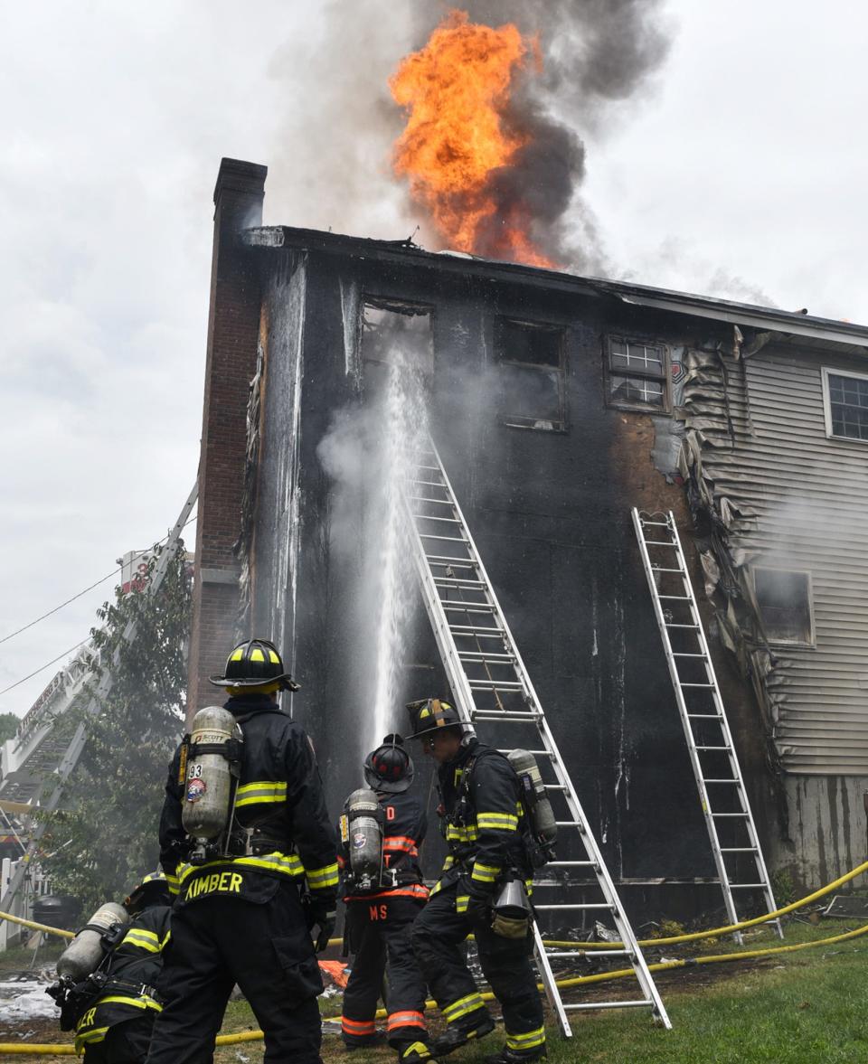 Fitchburg firefighters work the scene of the Wednesday-morning blaze.