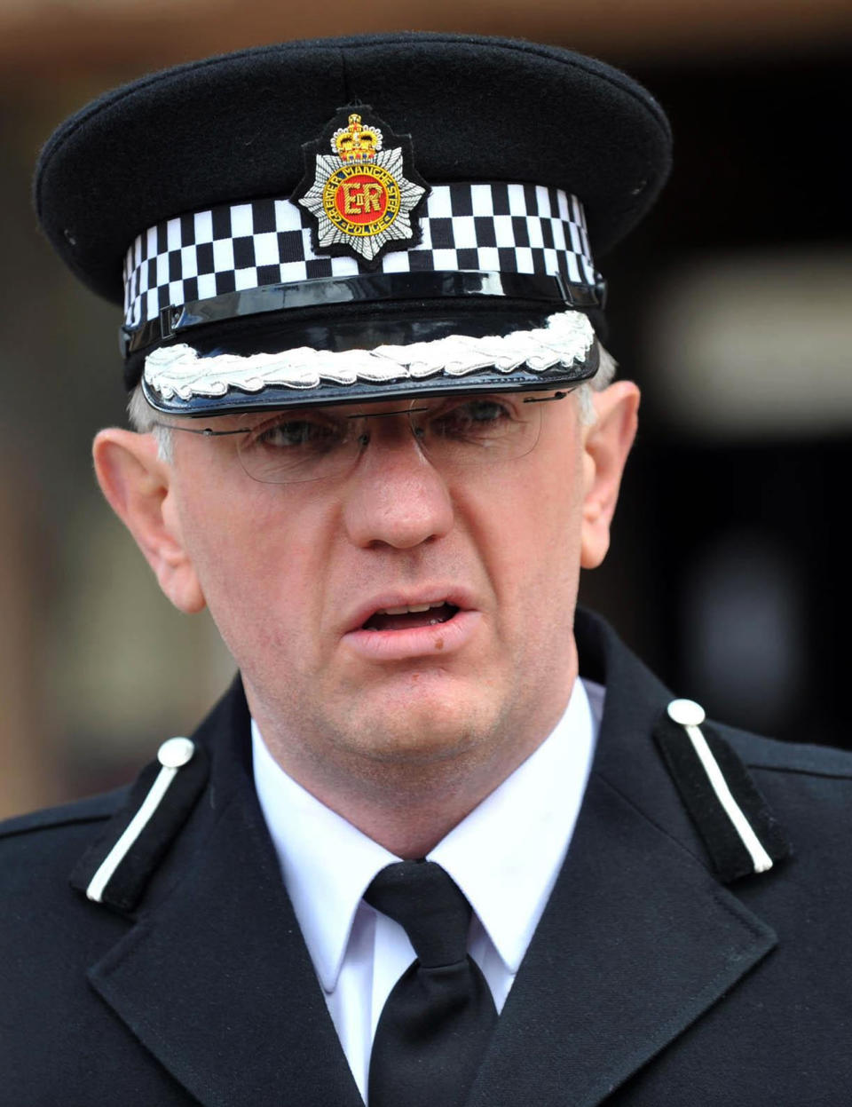 Greater Manchester Police Assistant Chief Constable Steve Heywood addresses the media following a trial at Liverpool Crown Court where nine men were found guilty of participating in a child sex ring, Liverpool, England, Tuesday, May 8, 2012. Nine men of Pakistani and Afghan descent were convicted Tuesday for participating in a child sex ring in a case that touched off deep sensitivities about race in Britain and galvanized the far right. (AP Photo/PA, Peter Byrne) UNITED KINGDOM OUT, NO SALES, NO ARCHIVE