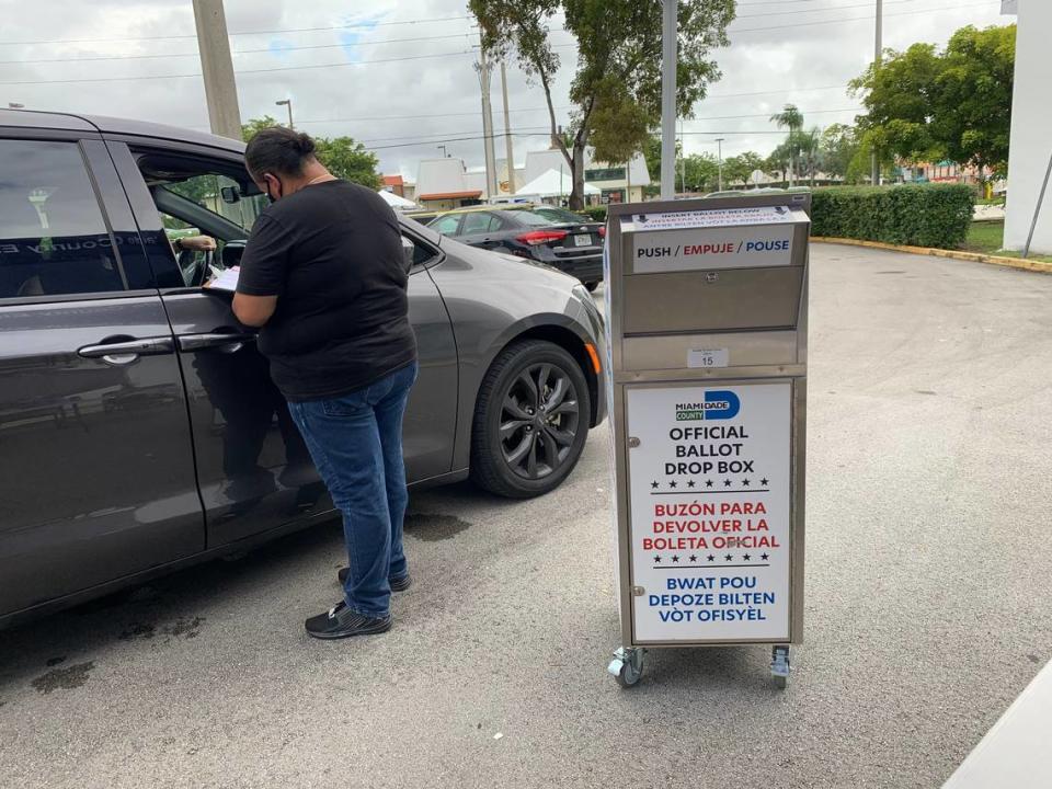 The voter’s mail-in ballot drop-off box at Kendall Branch Library at 9101 SW 97th Ave. in Miami, seen here on Oct. 22, 2022, has a drive-thru lane where a poll worker will check to make sure you signed the outside of your envelope and drop it into the box for you. Or you can walk up and drop it into the drop-off box during early voting hours of 7 a.m.-7 p.m. through Nov. 1 in Miami-Dade and Broward.