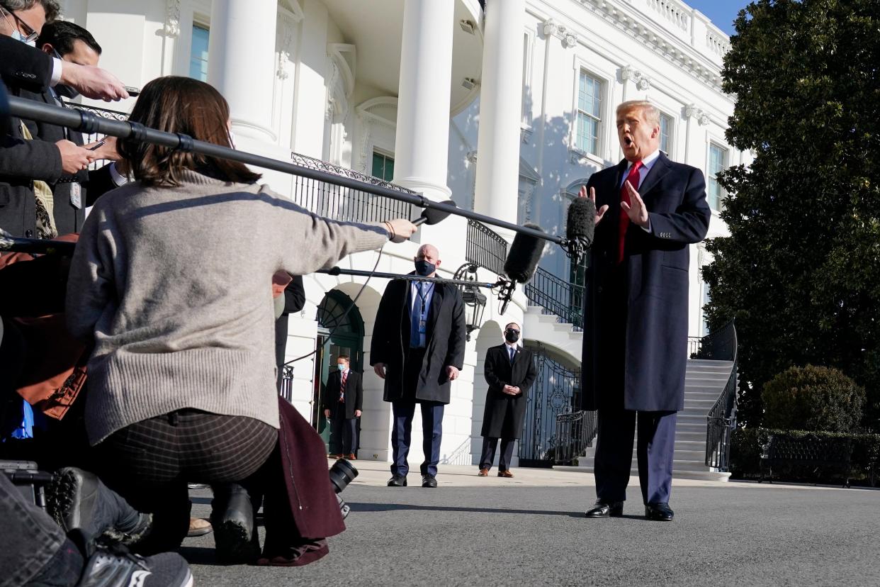 Donald Trump talks to the media before boarding Marine One on the South Lawn of the White House, 12 January, 2021 (AP)