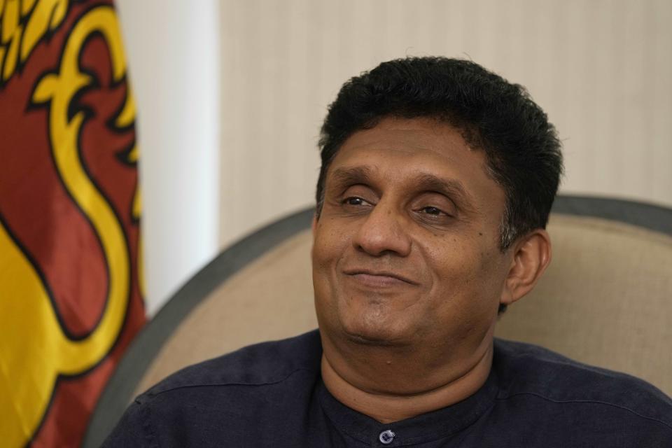 Sri Lankan opposition leader Sajith Premadasa smiles during an interview with The Associated Press at his office in Colombo, Sri Lanka, Friday, July 15, 2022. Premadasa, who is seeking the presidency next week, vowed Friday to “listen to the people” who are struggling through the island nation’s worst economic crisis and to hold accountable the president who fled under pressure from protesters. (AP Photo/Eranga Jayawardena)