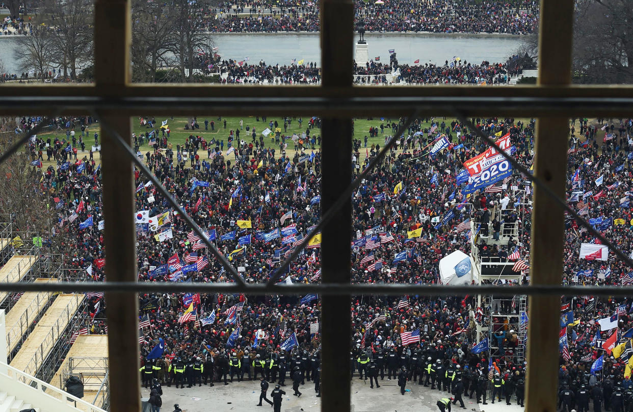 Rioters gather outside the Capitol's Rotunda (Olivier Douliery / AFP via Getty Images file)