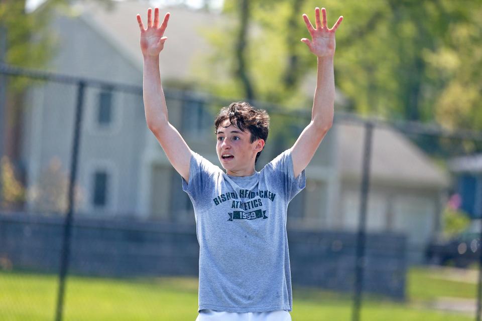 Hendricken's Jack Ciunci raises his arms in triumph following the final point that sealed his three-set win over La Salle's Tomas Medina in Sunday's RIIL State Singles Tournament final.