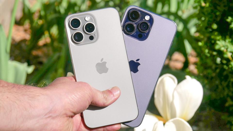 iPhone 15 Pro Max vs iPhone 14 Pro Max in hand.