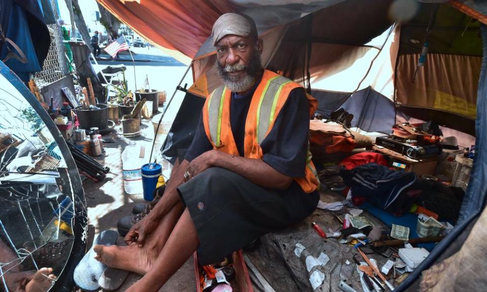 Kendrick Bailey, a homeless veteran, inside his tent on a street corner near Skid Row in downtown Los Angeles.