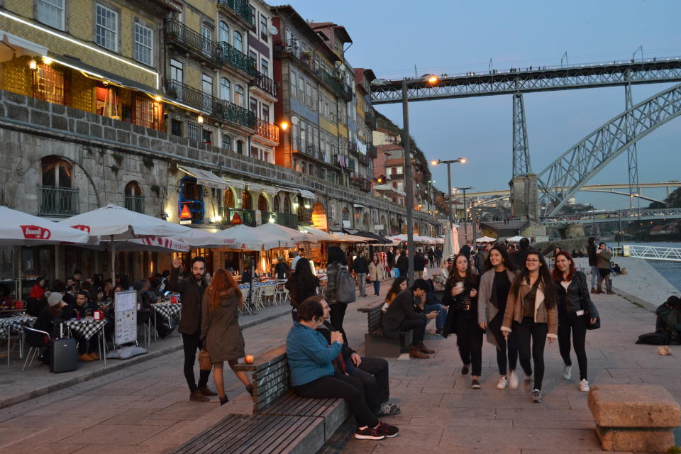 CORRECT SPELLING OF RIVER TO DOURO - This Feb. 16, 2017 photo shows the waterfront Ribeira district along the Douro River in Porto, Portugal. The river separates Porto from Vila Nova de Gaia, where the famous port wine caves are located. (Albert Stumm via AP)