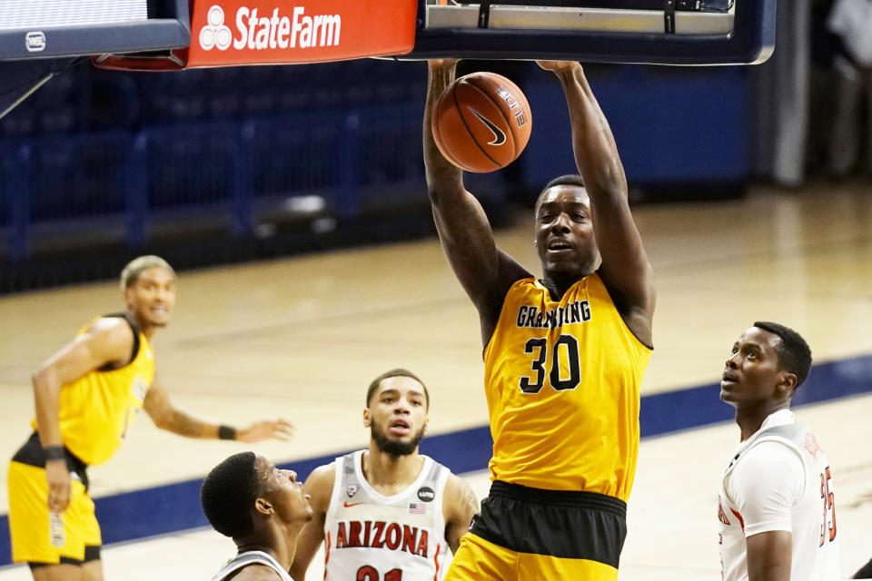 Grambling forward Brian Thomas (30) dunks against Arizona during the first half of an NCAA college basketball game Friday, Nov. 27, 2020, in Tucson, Ariz. (AP Photo/Rick Scuteri)